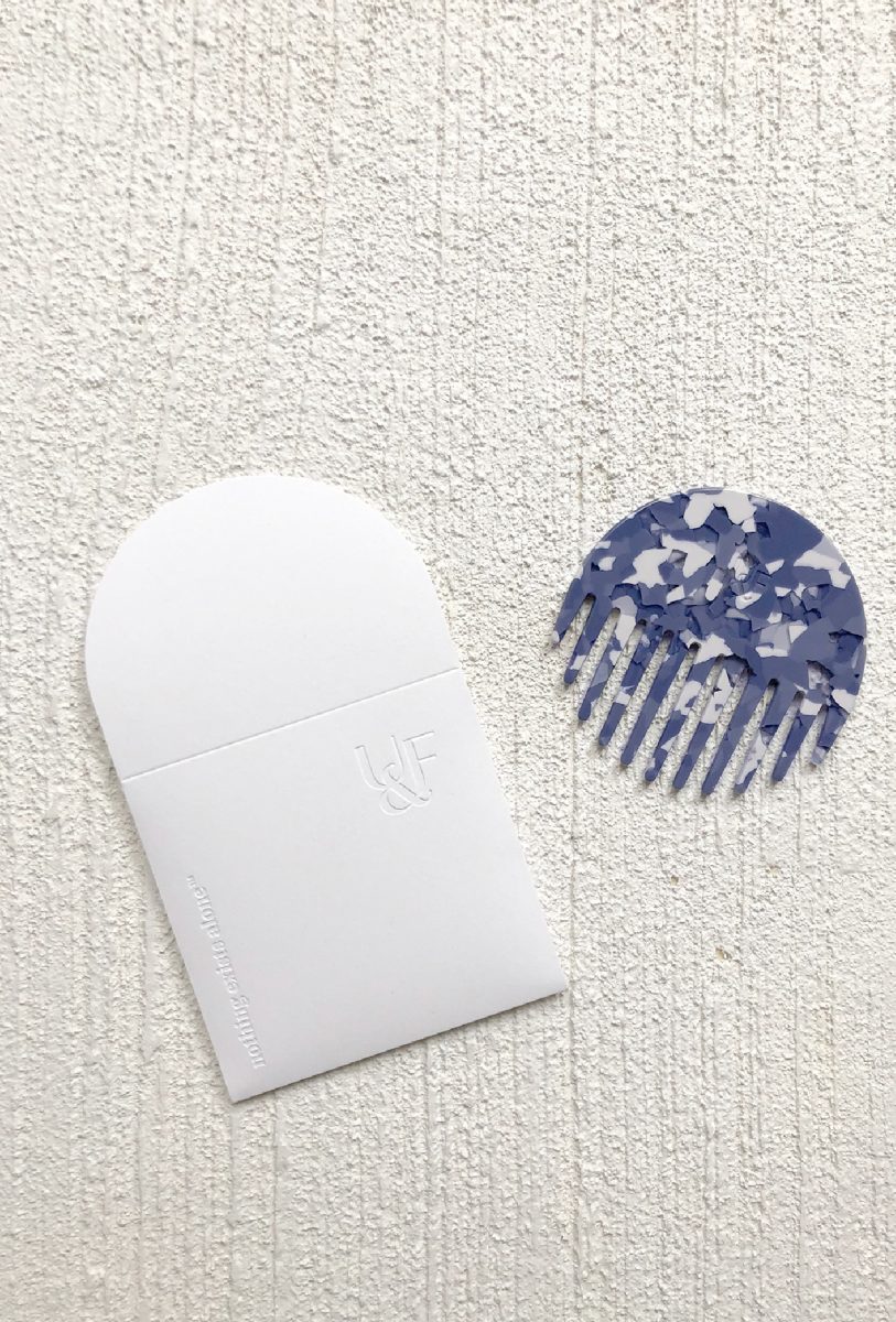 Plant cellulose comb in custom brand blue with FSC Certified paper pouch for United & Free