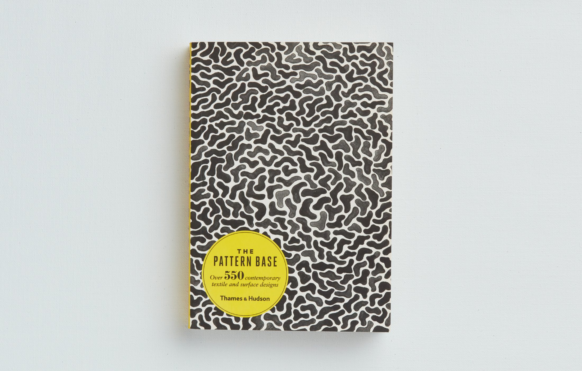 The Pattern Base book cover featuring custom illustrations and patterns by arithmetic creative.